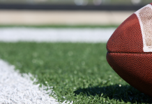 An Event Planning Guide to the 2024-2025 NFL Season Close up of a football on the field