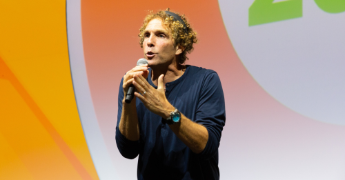 Keynote speaker Jesse Itzler delivers a speech